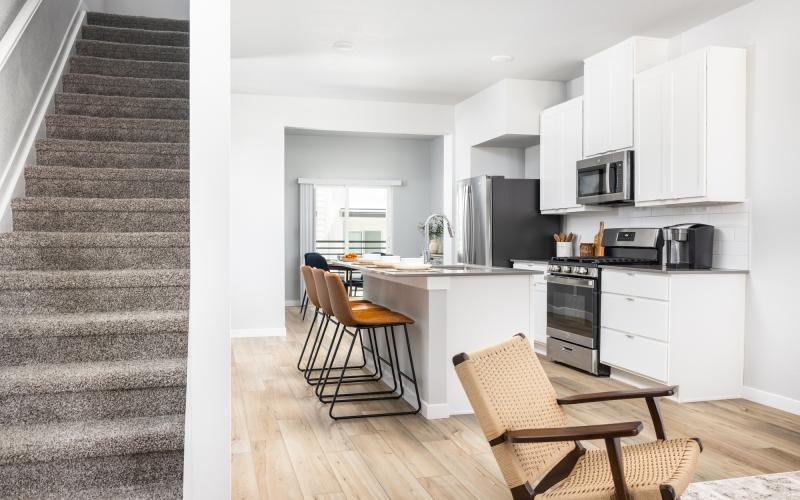 a kitchen with white cabinets