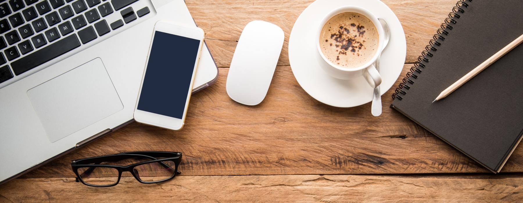 a cup of coffee and a laptop