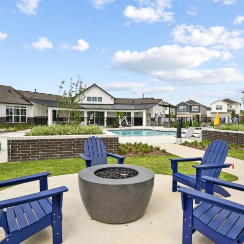 a pool with chairs around it