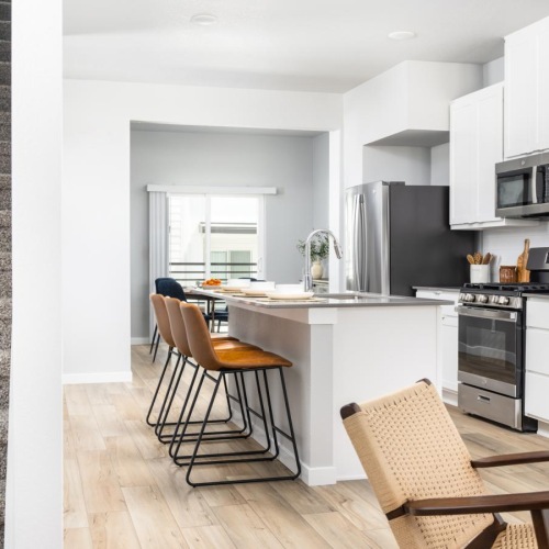 a kitchen with white cabinets