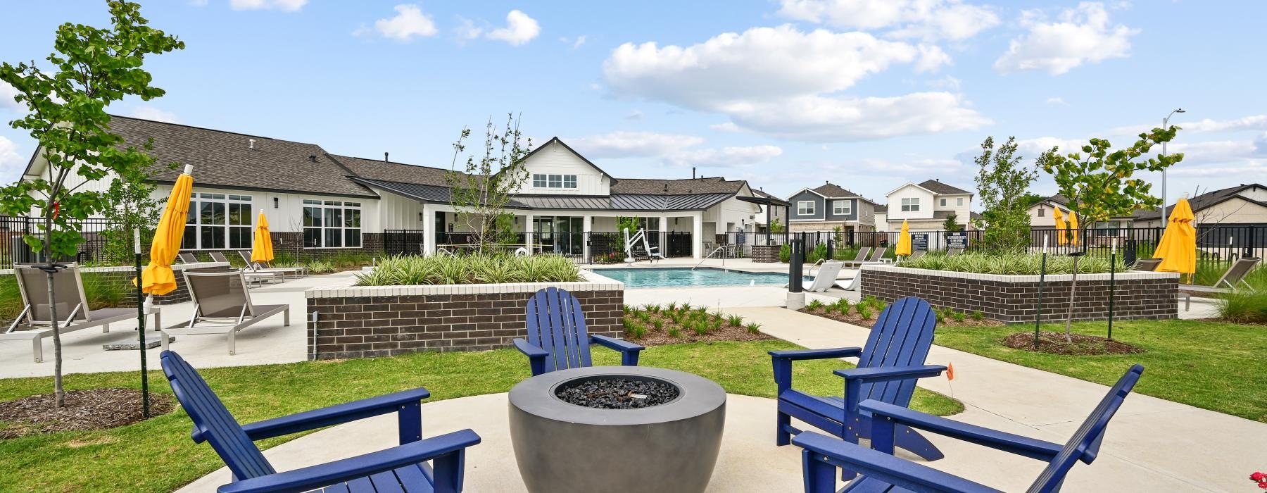 a pool with chairs around it